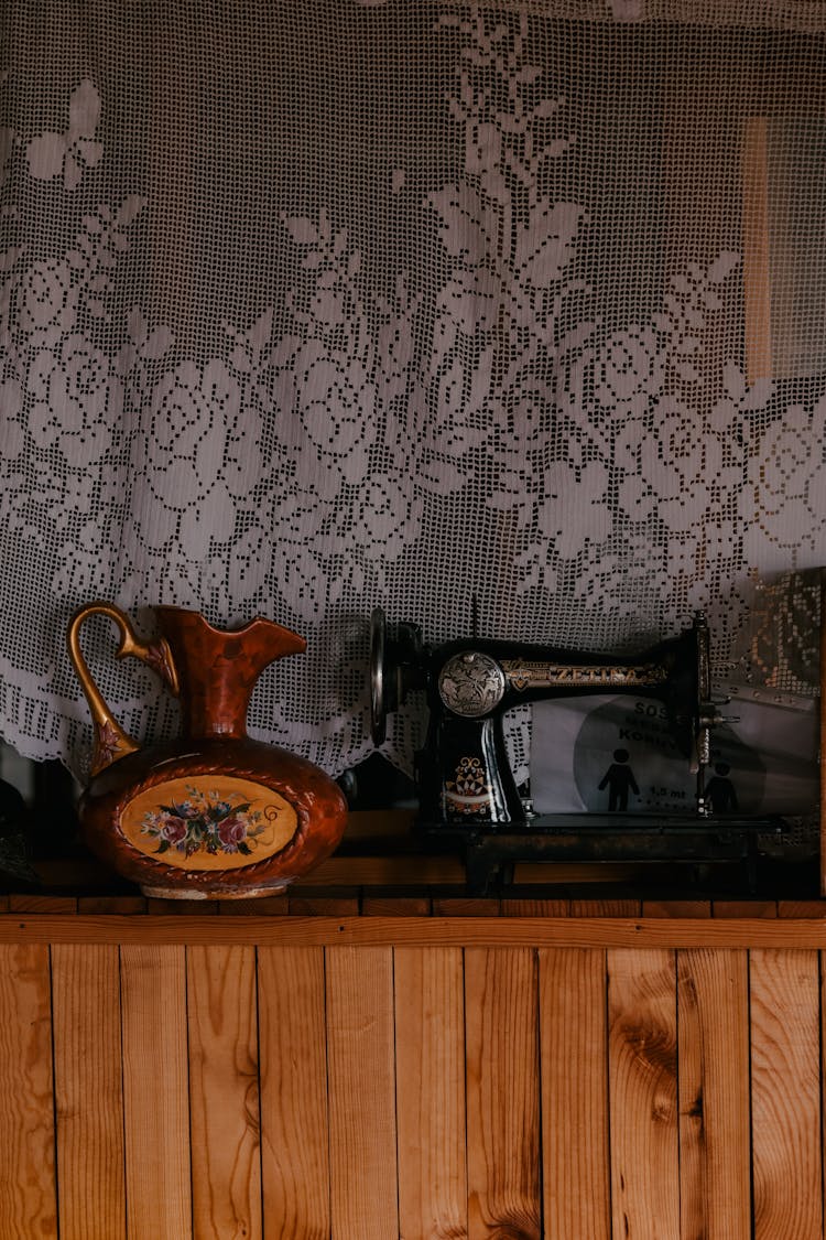 Vintage Sewing Machine On Wooden Surface