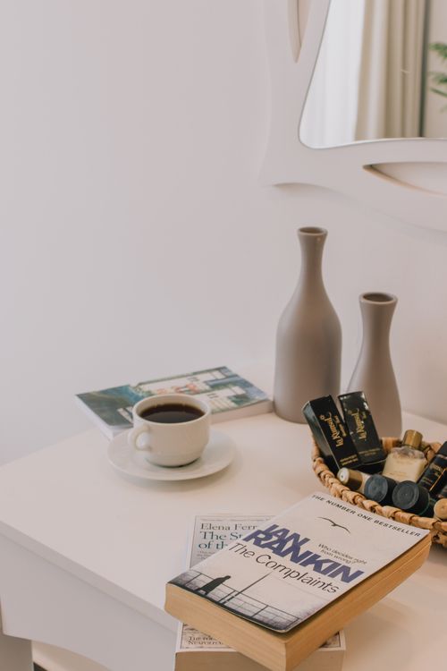 Free A serene setup with books and coffee on a wooden table, perfect for relaxation. Stock Photo