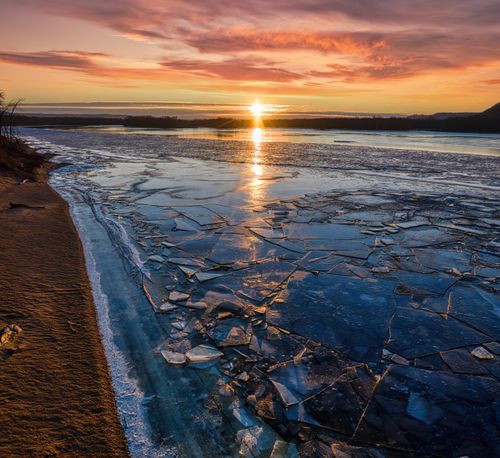 Free A breathtaking view of a frozen lake during sunset in Reads Landing, Minnesota. Stock Photo