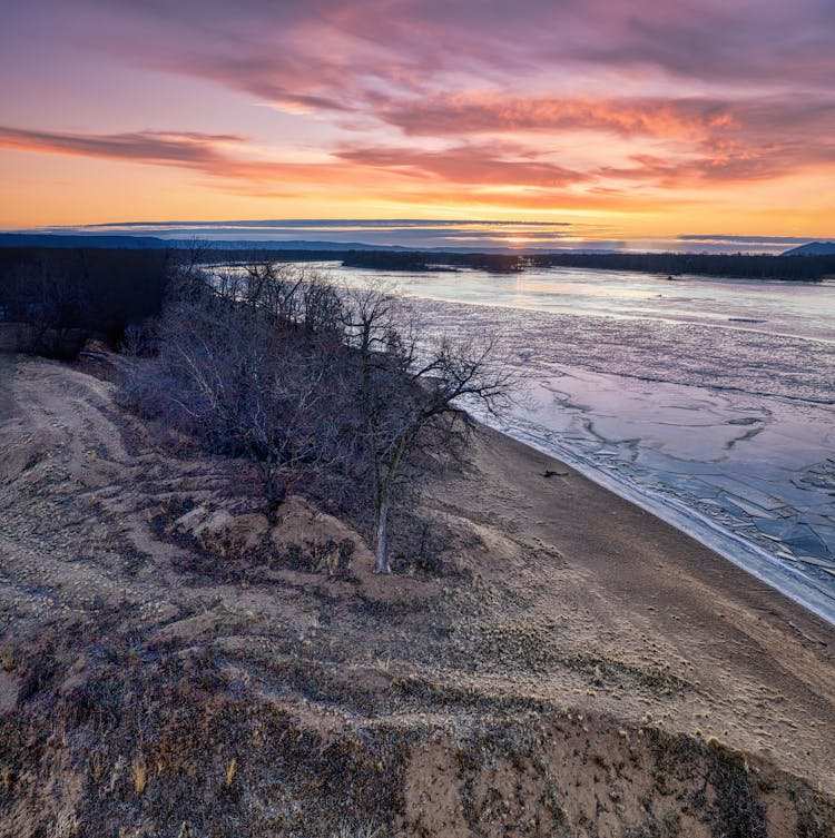 River Bank On Sunset