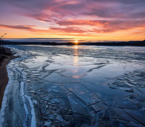 Free Stunning sunrise view over a frozen lake in Reads Landing, Minnesota, USA. Stock Photo