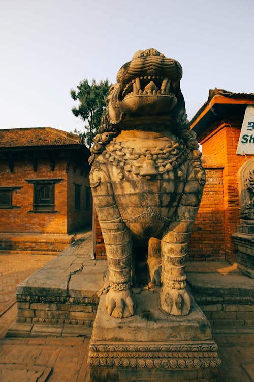 Brown Concrete Lion Statue