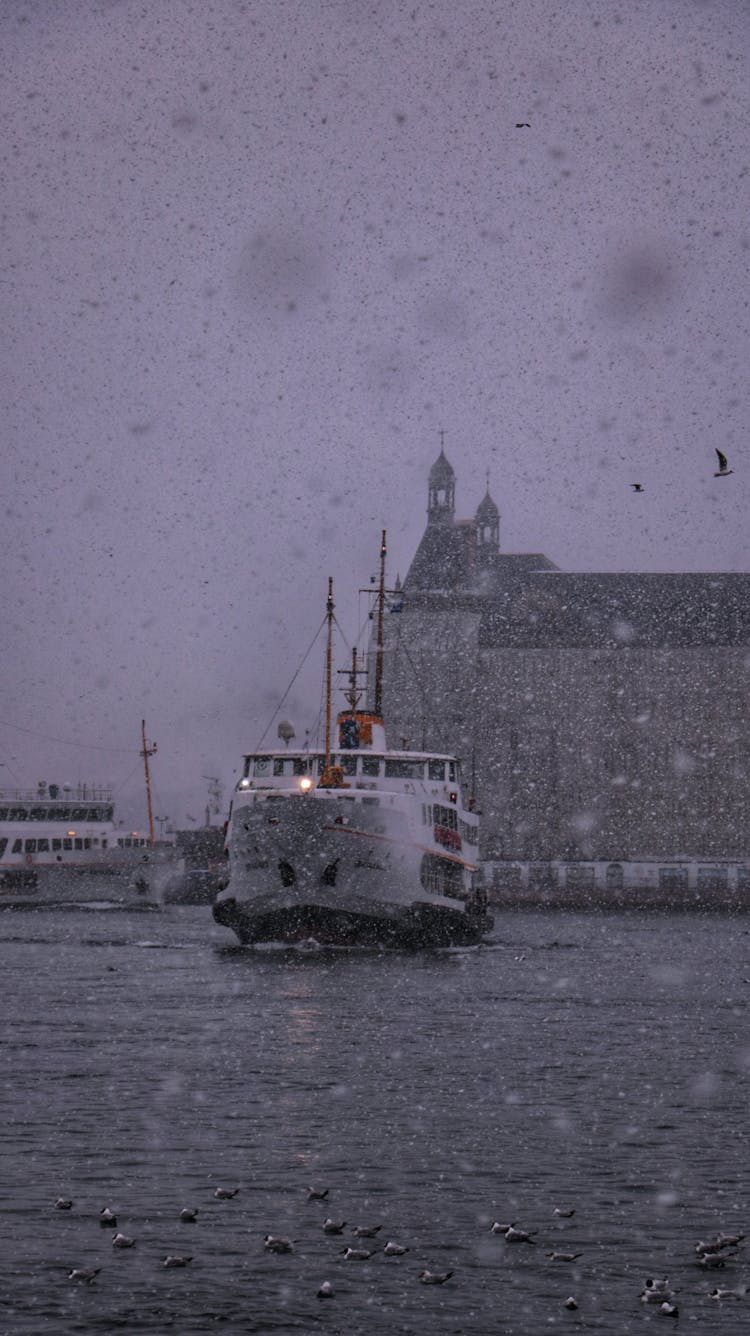 Ferry Sailing In Snow