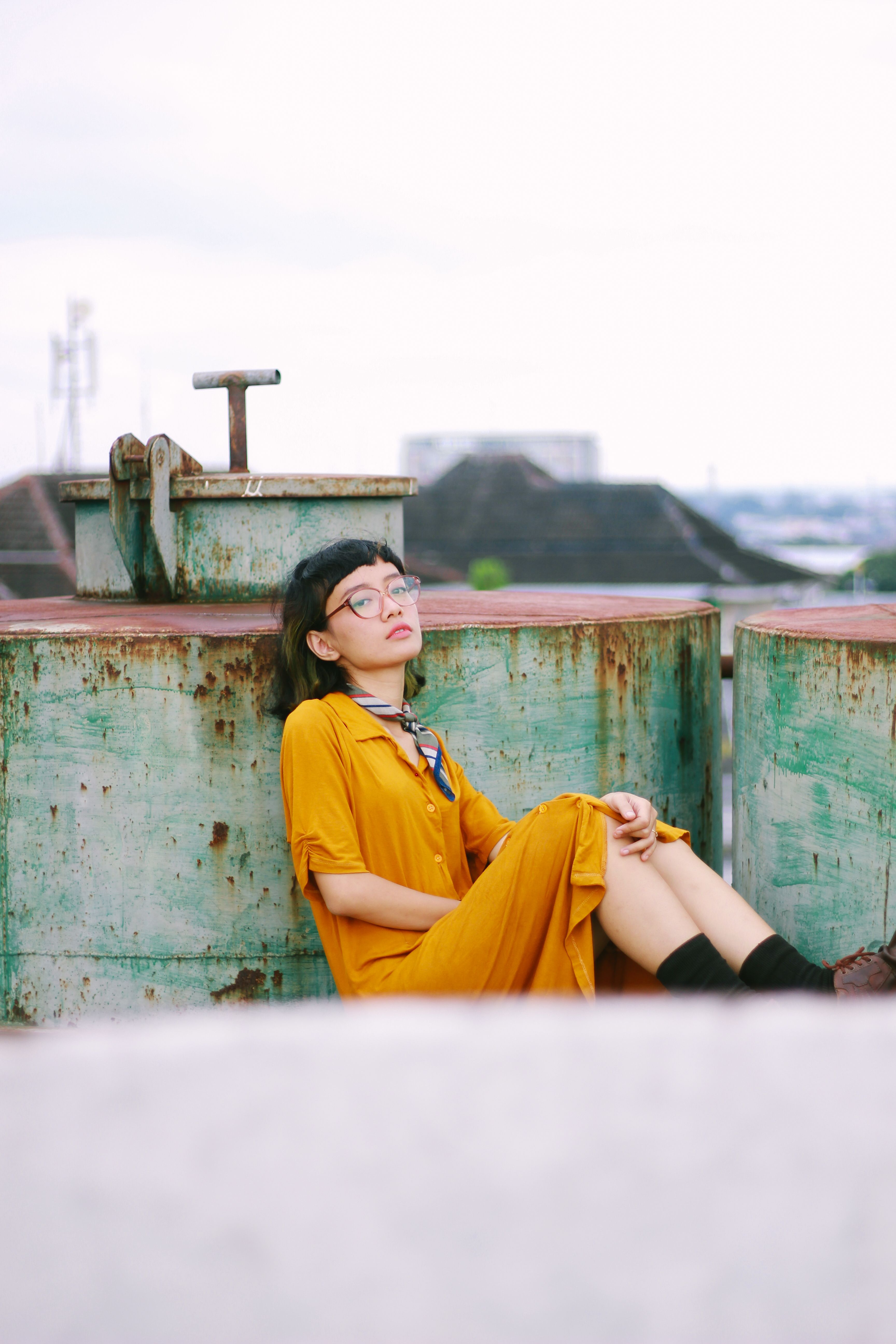 A Woman Wearing Yellow Dress Sitting on the Floor · Free Stock Photo