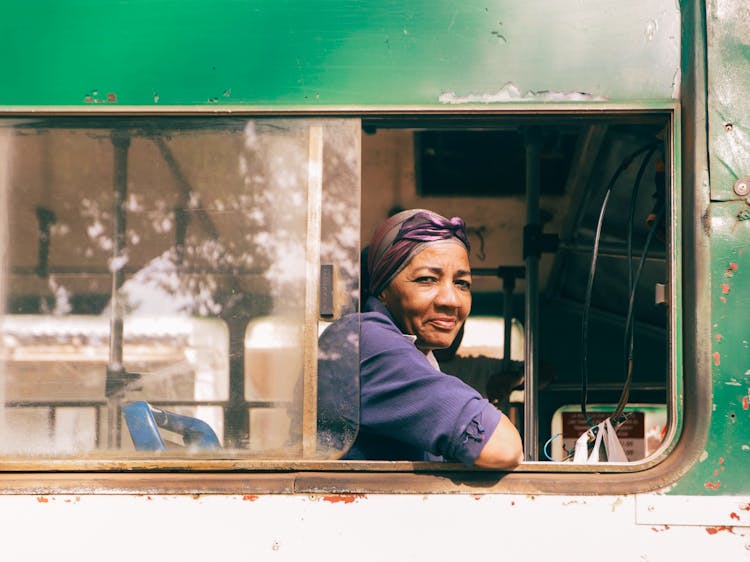 Woman Posing In Bus Window