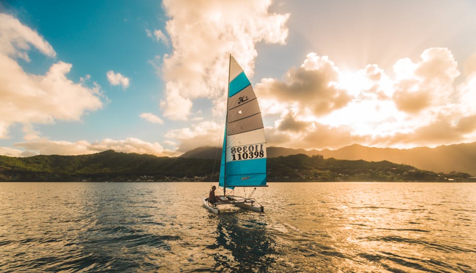 White Sailing Boat on Body of Water