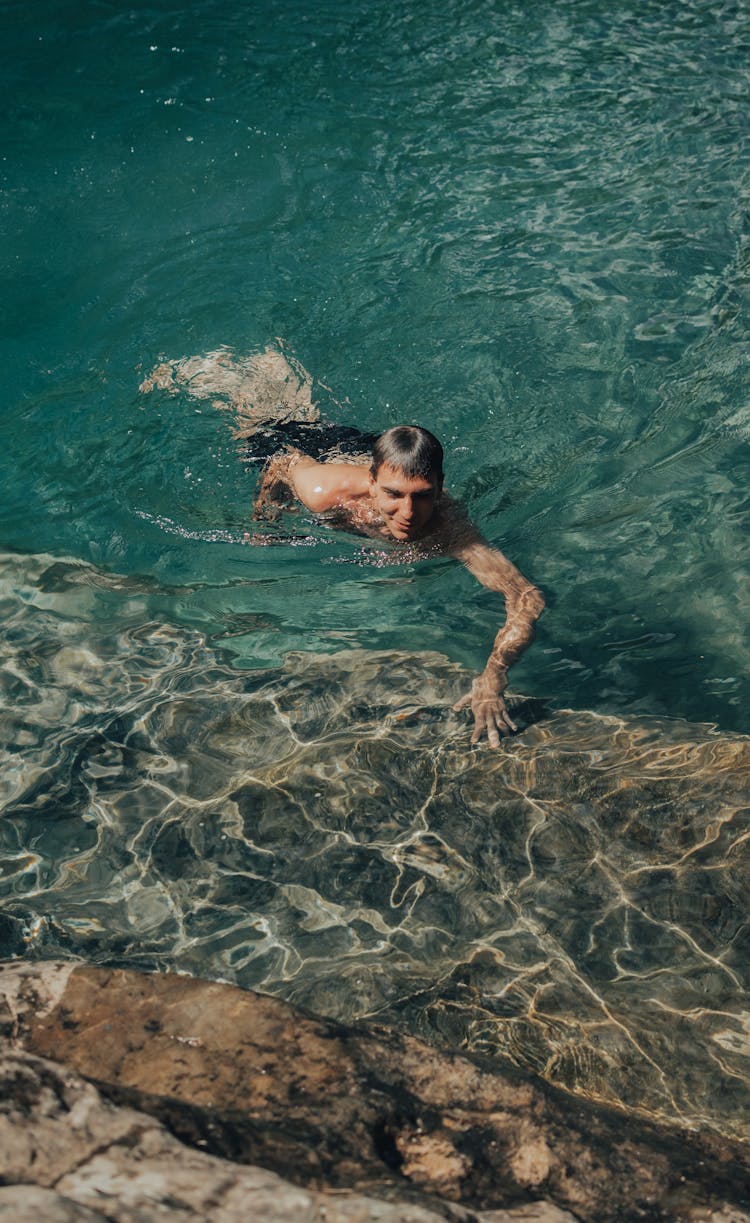 Man Swimming In Sea