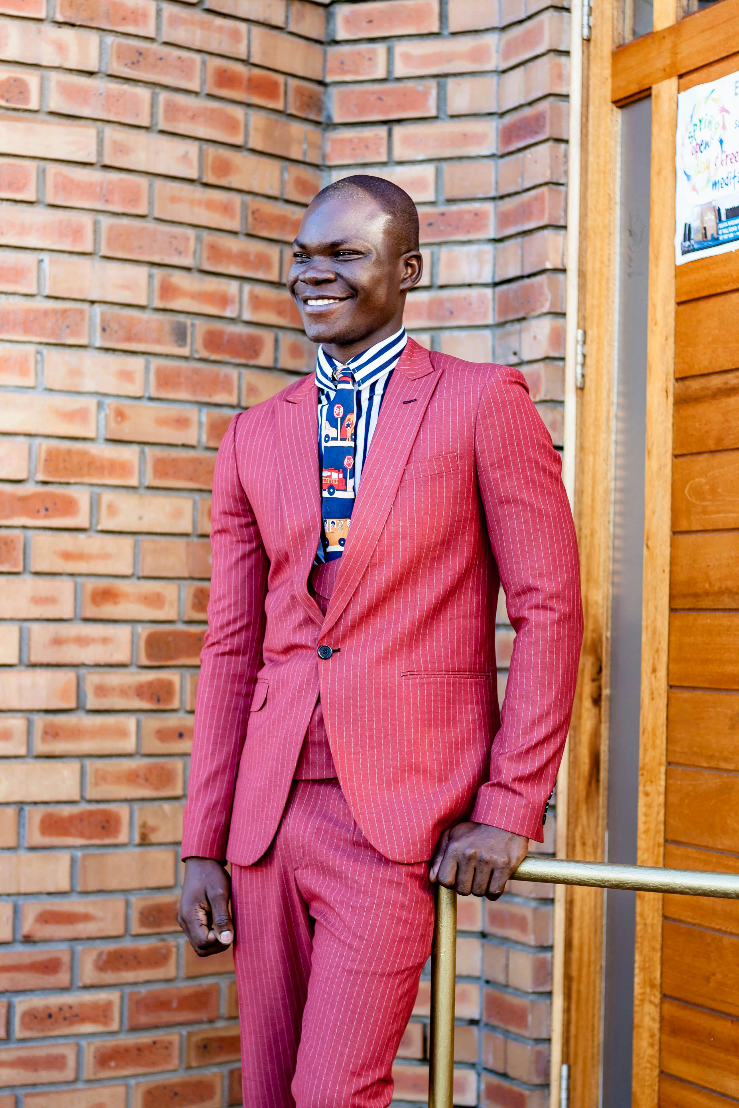 Male Model Posing in Red Suit · Free Stock Photo