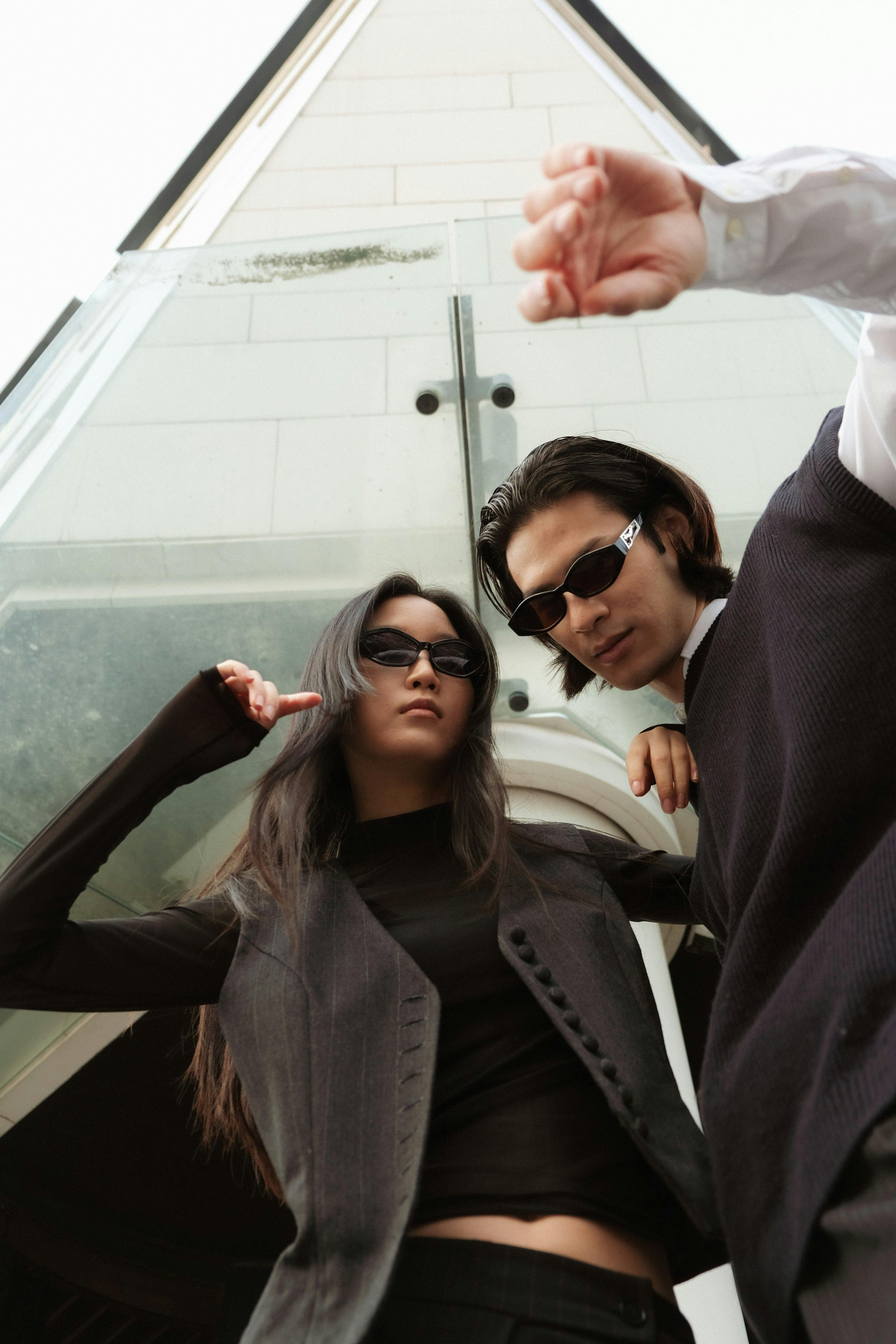 young female and male model posing in sunglasses