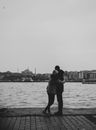 A Couple Hugging Standing by the Seaside