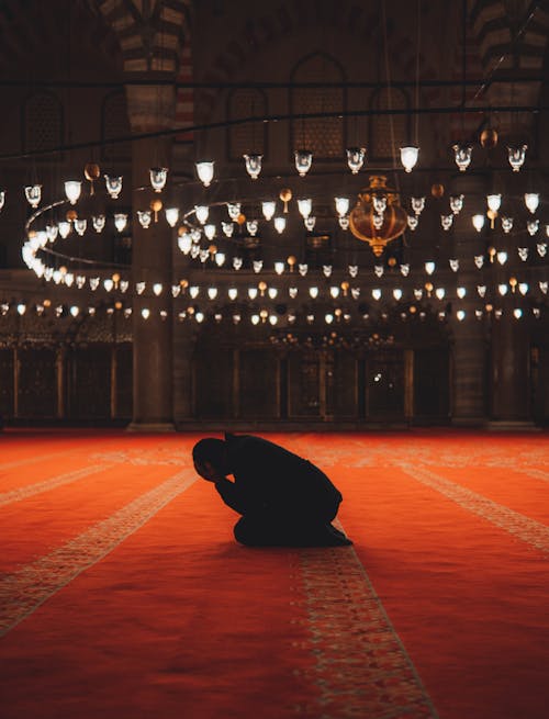 Free Man Praying in Mosque Stock Photo