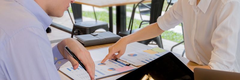 Team collaboration over financial documents in a modern office setting.