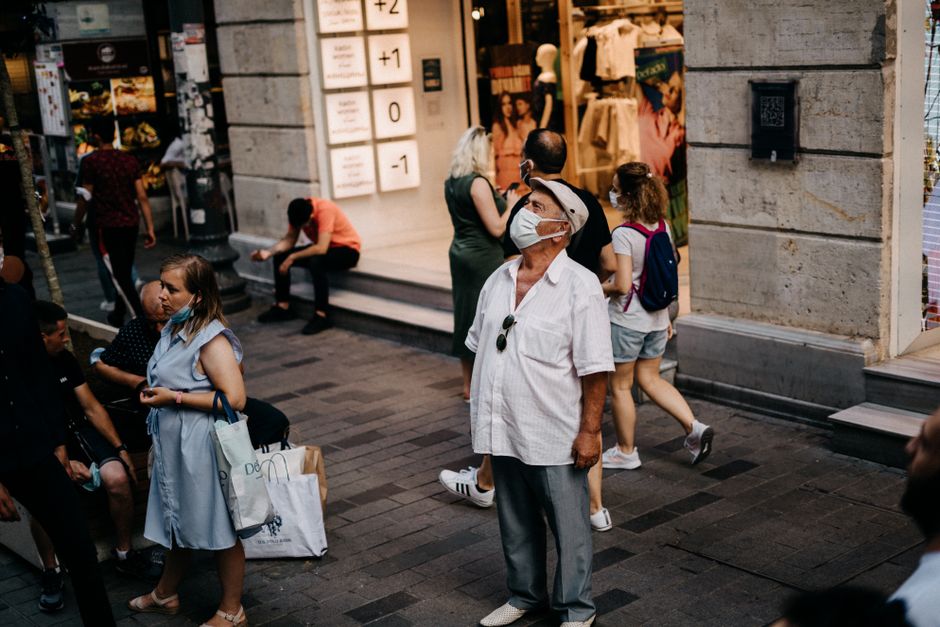 diverse people outside storefront