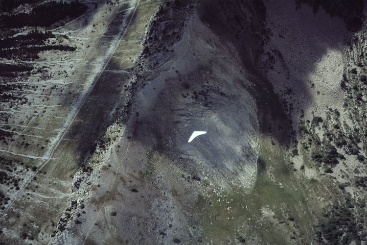 
An Aerial Shot Of A Person Hang Gliding