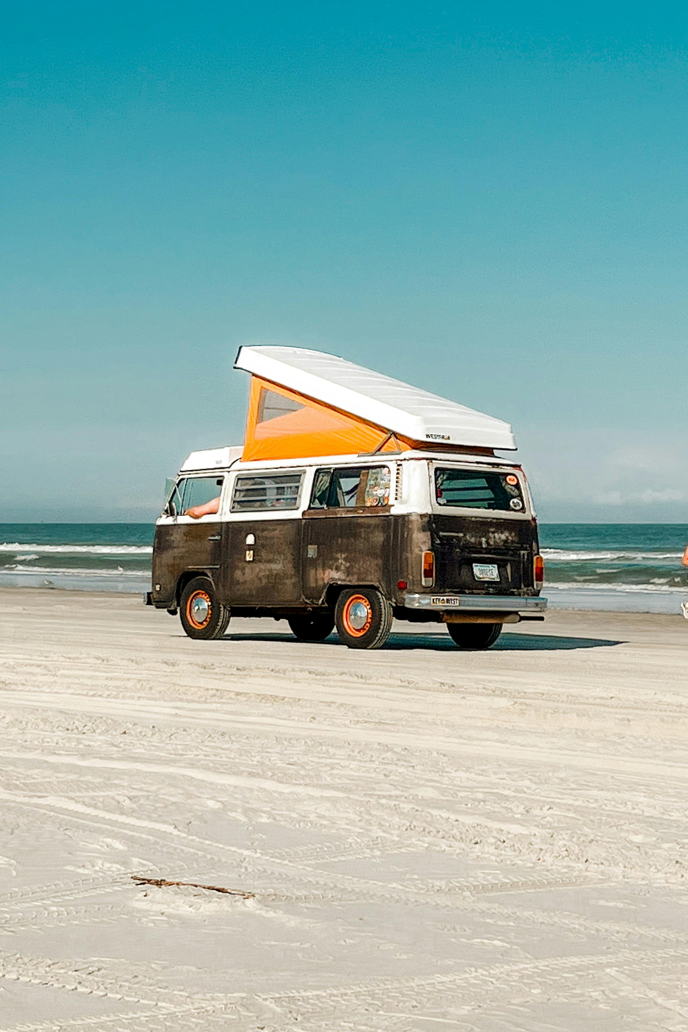 old bintage van parked on beach