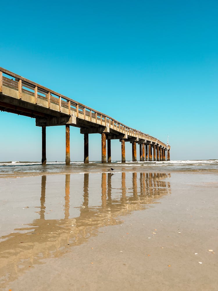 Reflection Of The St. Augustine Beach Pier On The Coast