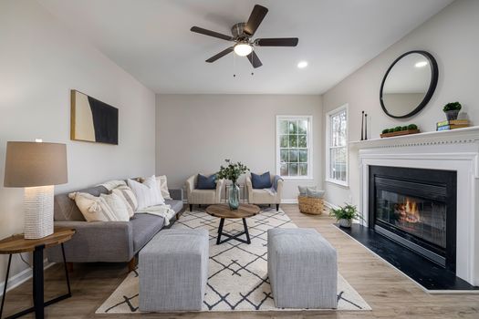 Stylishly decorated living room with fireplace and modern furniture for a cozy atmosphere.