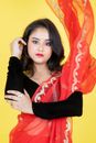Woman in Black Long Sleeve Shirt and Orange Scarf