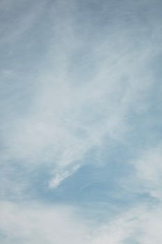 A tranquil view of soft clouds against a bright blue sky, perfect for backgrounds.