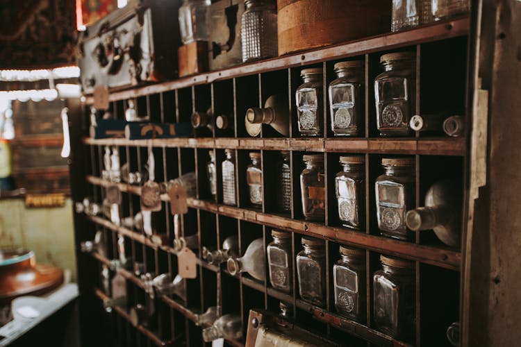 Antique Bottles On An Apothecary Shelf