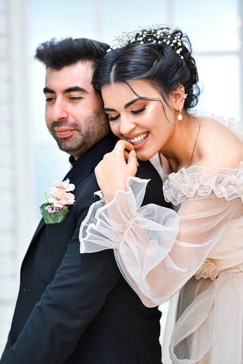 Photo of a Bride and Groom Embracing