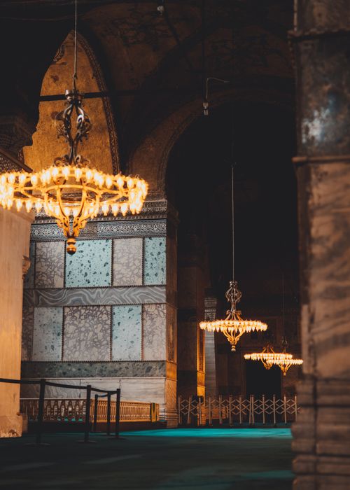 Free Stunning chandeliers illuminate the historic interior of Hagia Sophia in Istanbul. Stock Photo