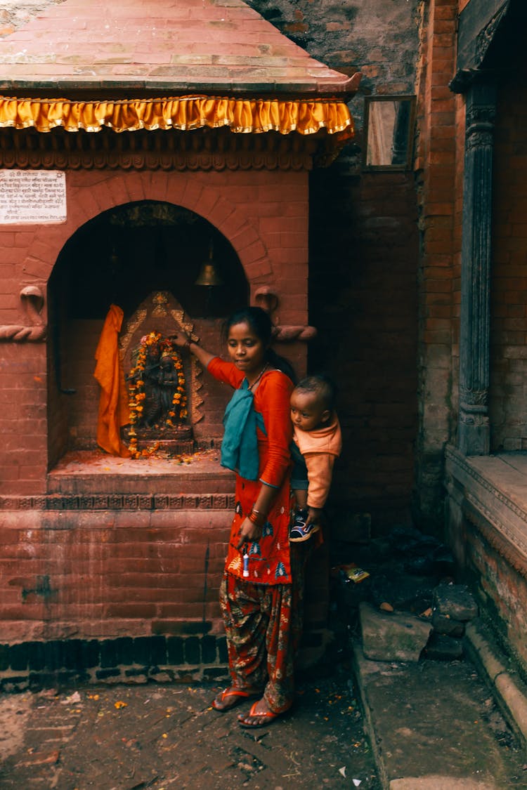 Woman With A Baby On Her Back 