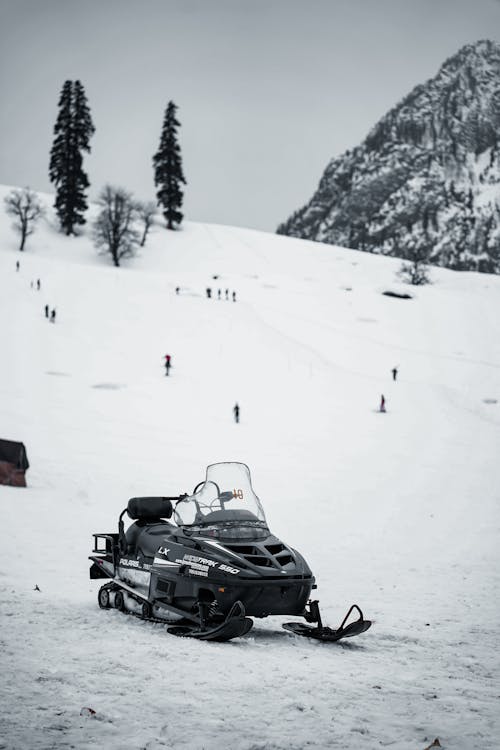 Free A Parked Black Snowmobile Stock Photo