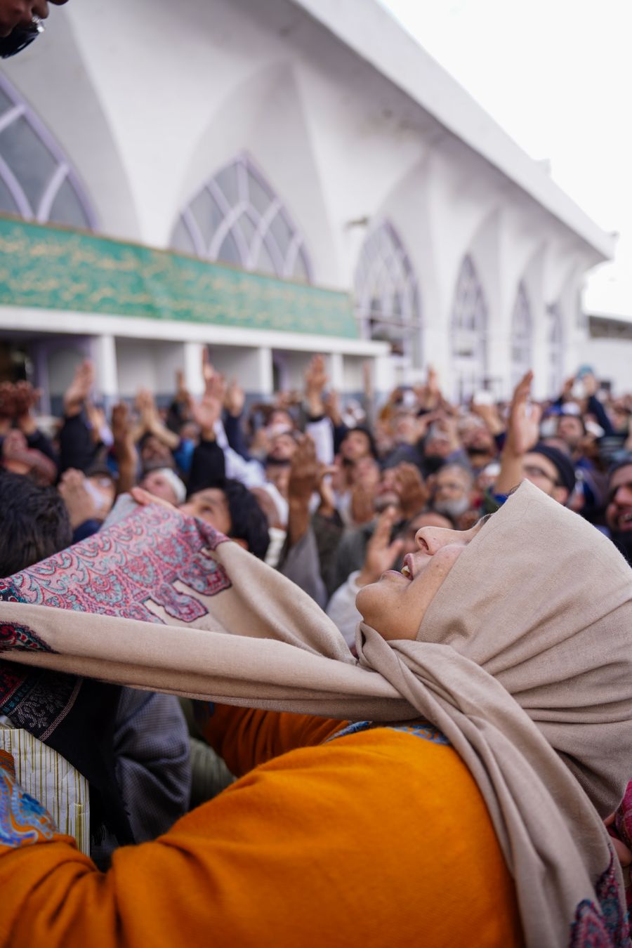 A joyful Muslim community gathering outside a mosque