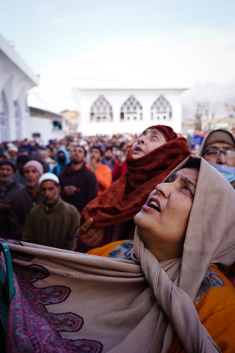 Faces Of Praying Crowd