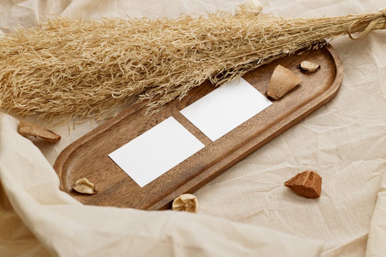 Wheat And Paper On Wooden Board