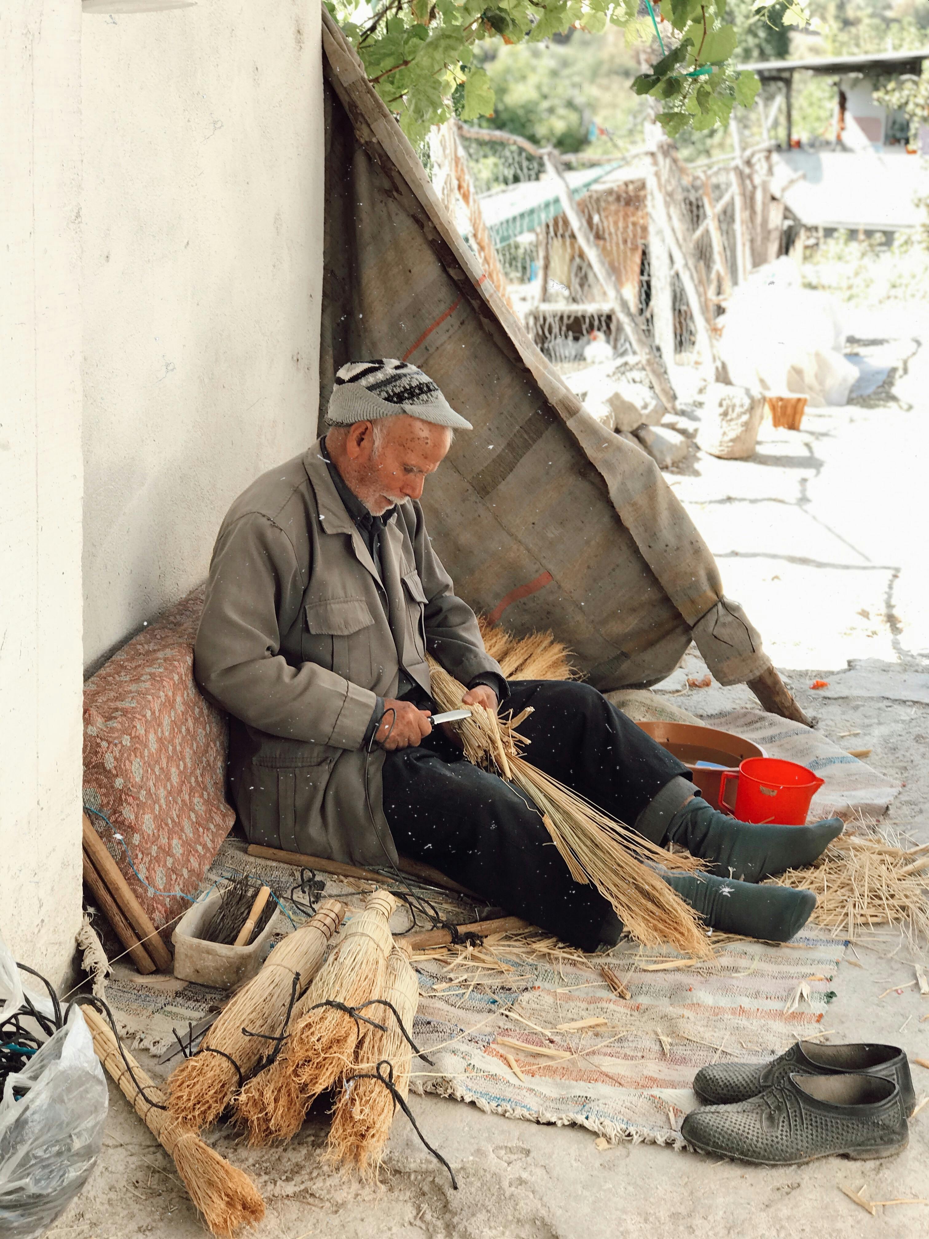 man cutting wicker