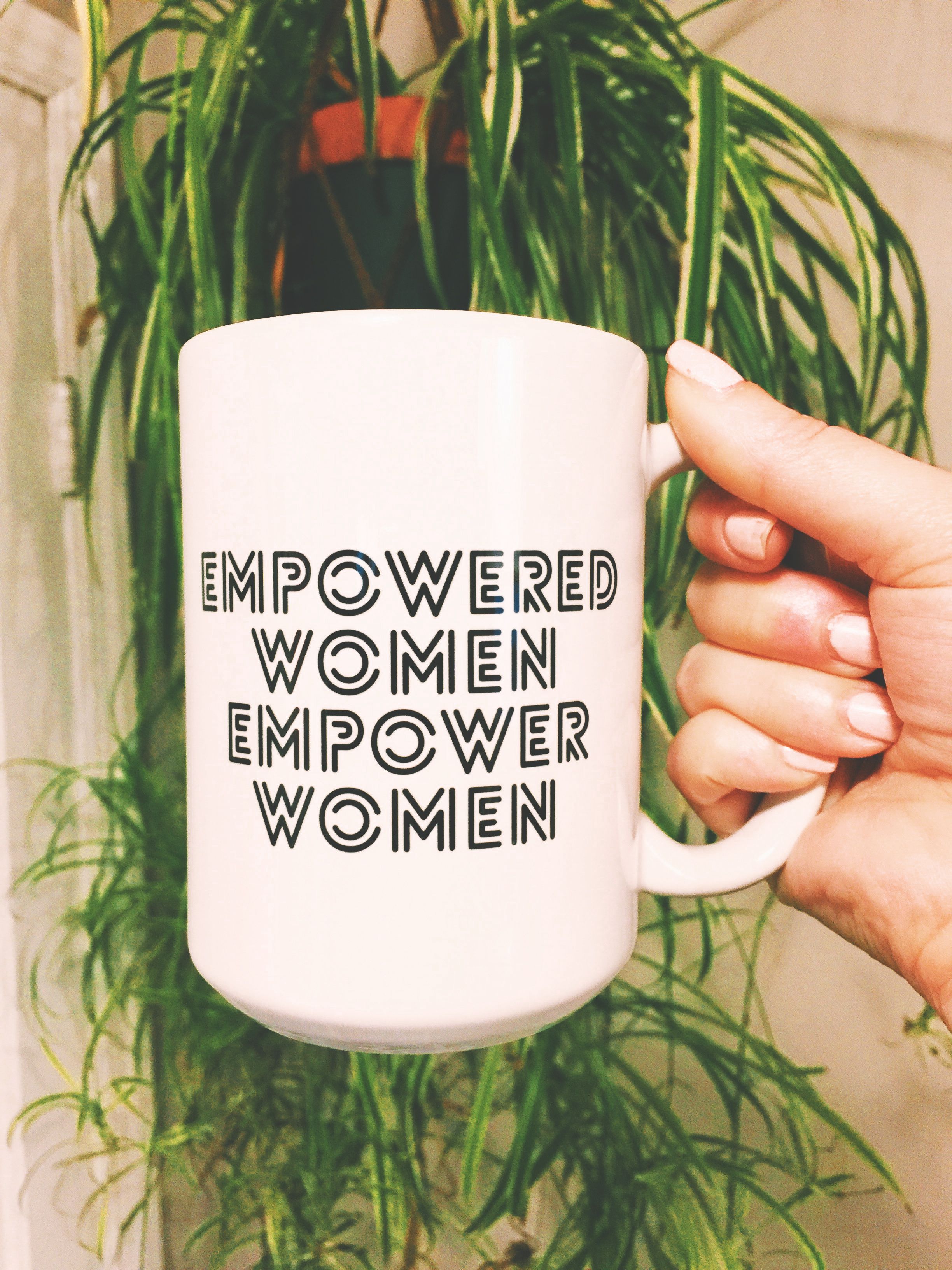 Person Holding a Ceramic Mug