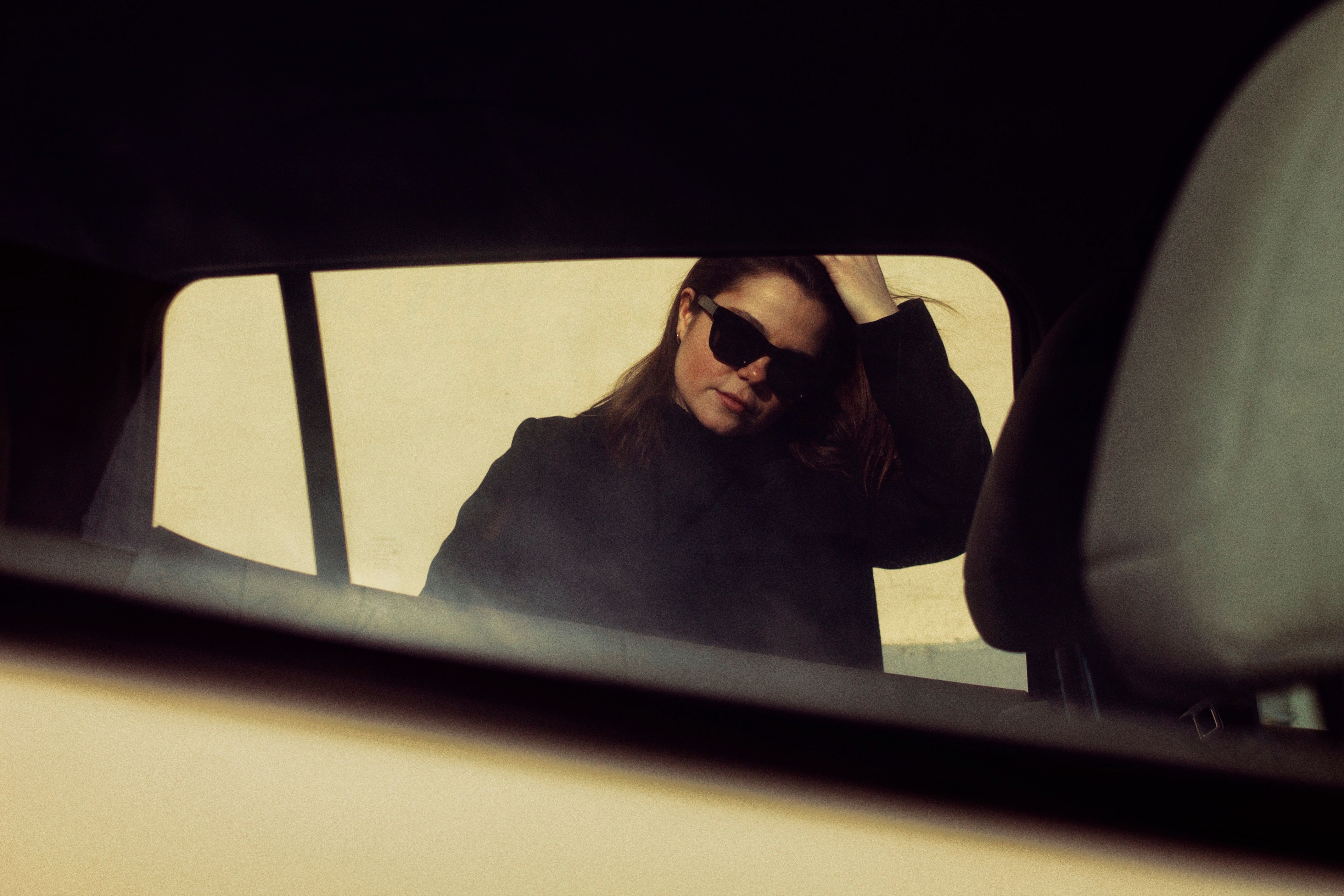 Brunette Woman in Car Window · Free Stock Photo