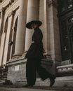 Young Man in Black Pastors Hat and Outfit 