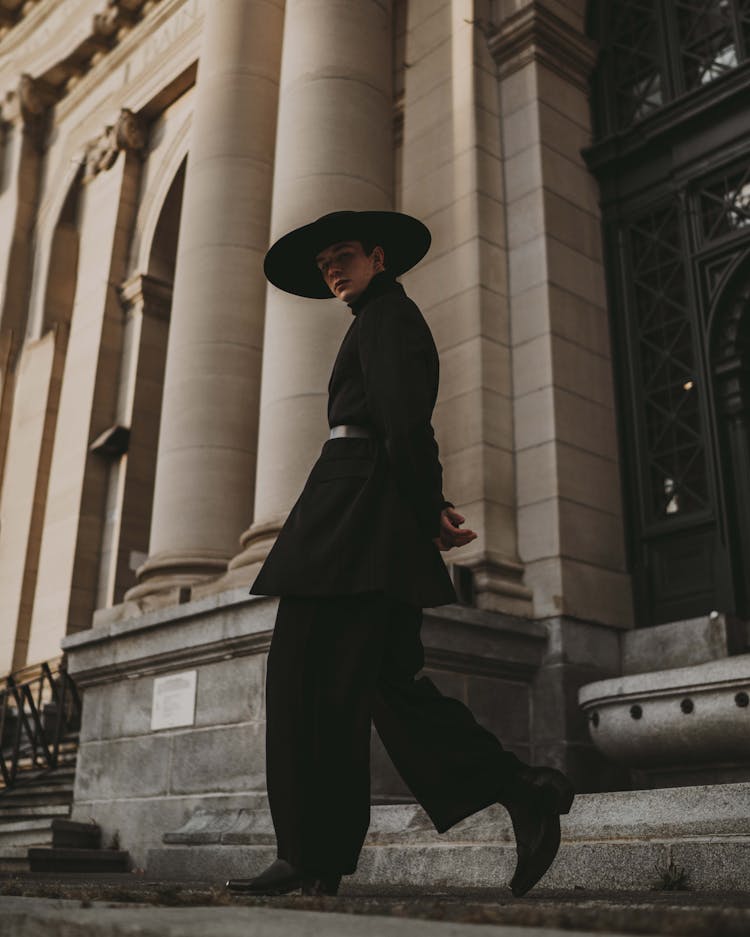 Young Man In Black Pastors Hat And Outfit 