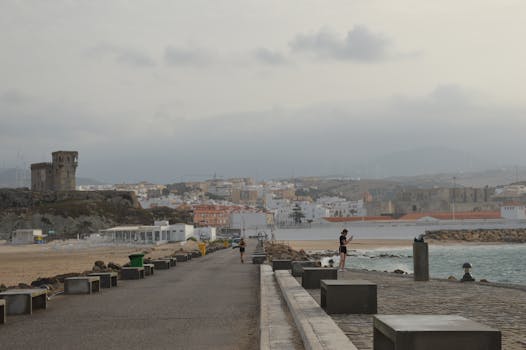 A scenic coastal town view from a seaside pathway, perfect for travel imagery.