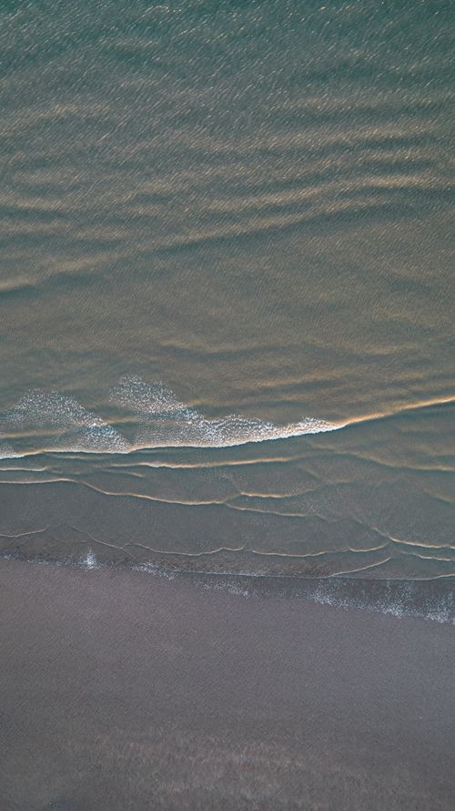 Free Drone shot capturing the serene coastline of Saint-Brevin-les-Pins, France. Stock Photo