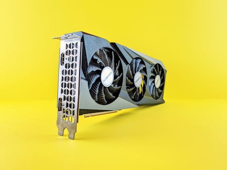 Close-up of a modern graphics card on a vibrant yellow background highlighting its design and technology.