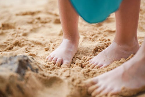 Free Babys Feet on Sand Stock Photo