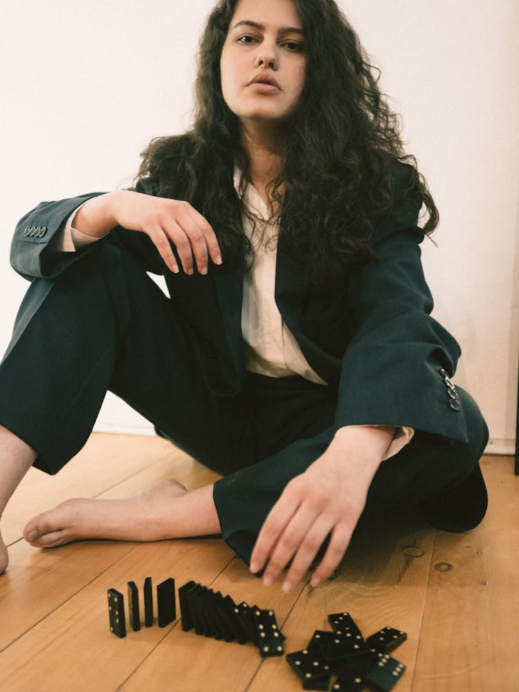 Woman In Suit Playing Dominoes