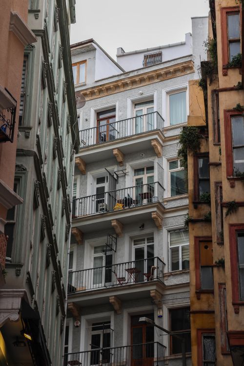 Free Low-angle view of historic apartment buildings in Istanbul's architectural district. Stock Photo
