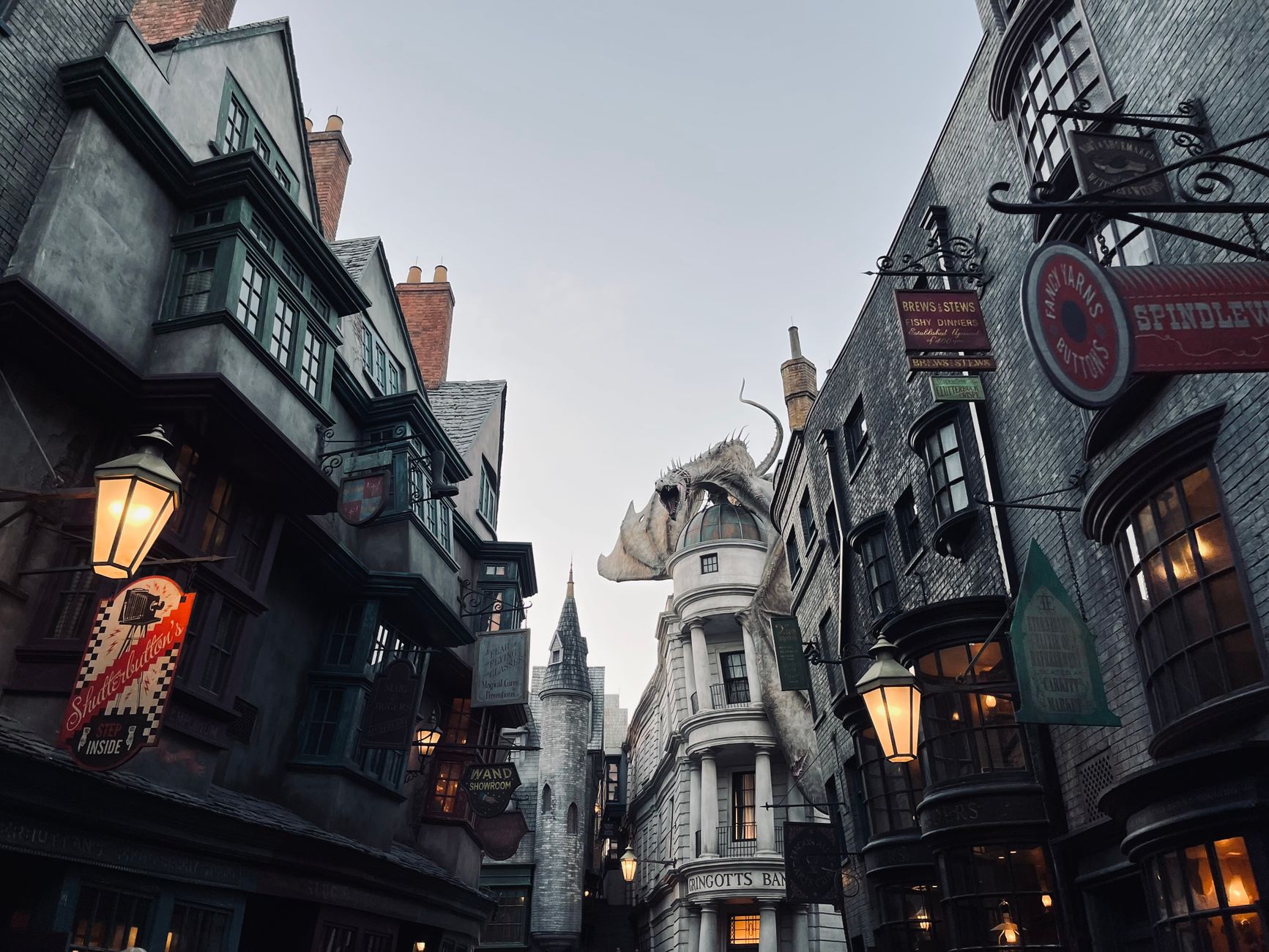 Immersive view of Diagon Alley at Universal Orlando, showcasing iconic architecture and detail.