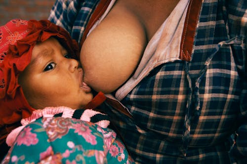 Woman Breastfeeding Child