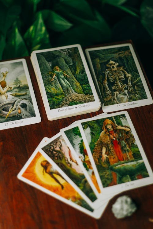 Free Set of Tarot Cards on a Wooden Surface Stock Photo