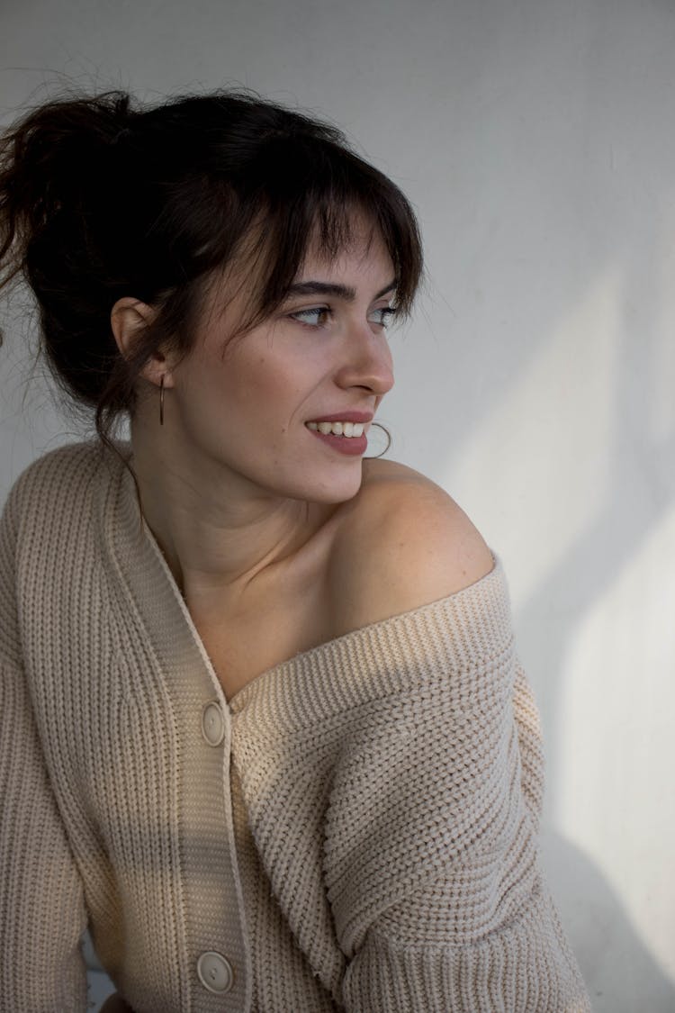 Smiling Woman In Knit Cardigan