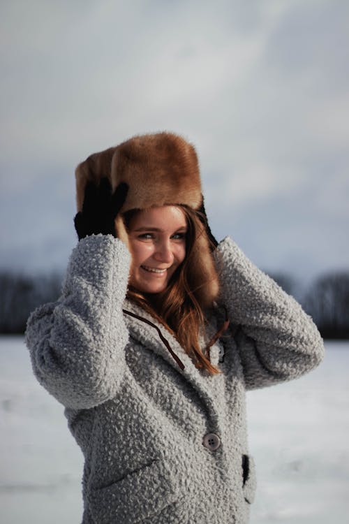 Woman in Gray Coat Wearing Ushanka