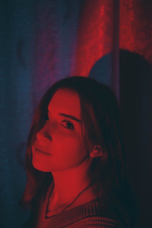 Portrait of Beautiful Woman in Red Light