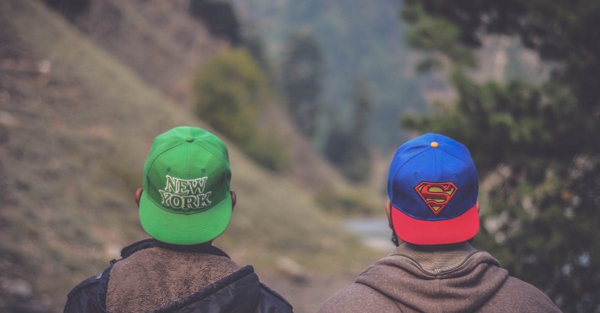 Shallow Focus Photography of Two Men Wearing Caps