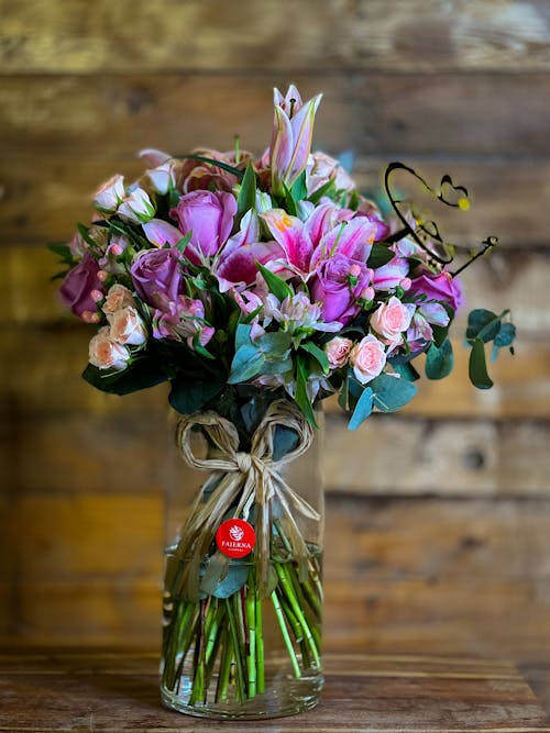 Free A Bouquet of Flowers in a Glass Vase  Stock Photo